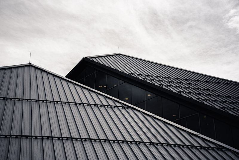 Modern metal roof and building facade construction using galvalume coated steel panels for durability and heat reflection