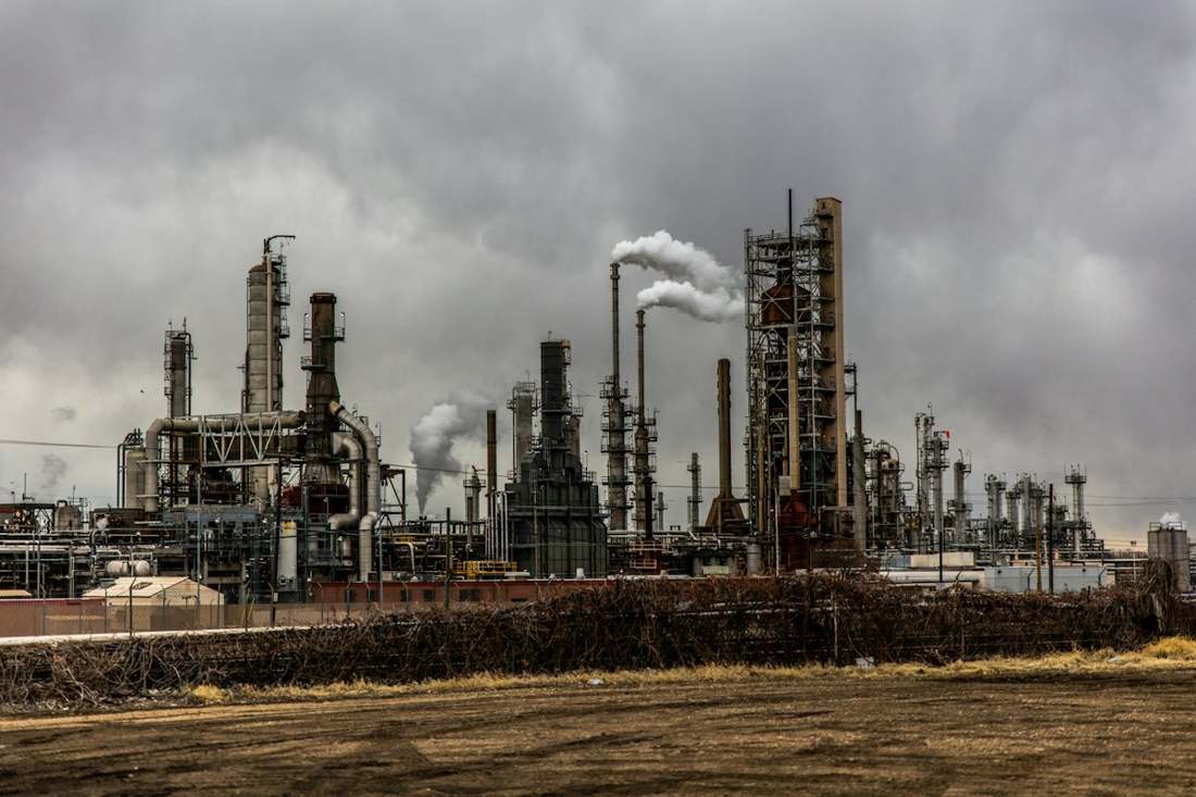 Petrochemical refinery plant with steel piping and towers