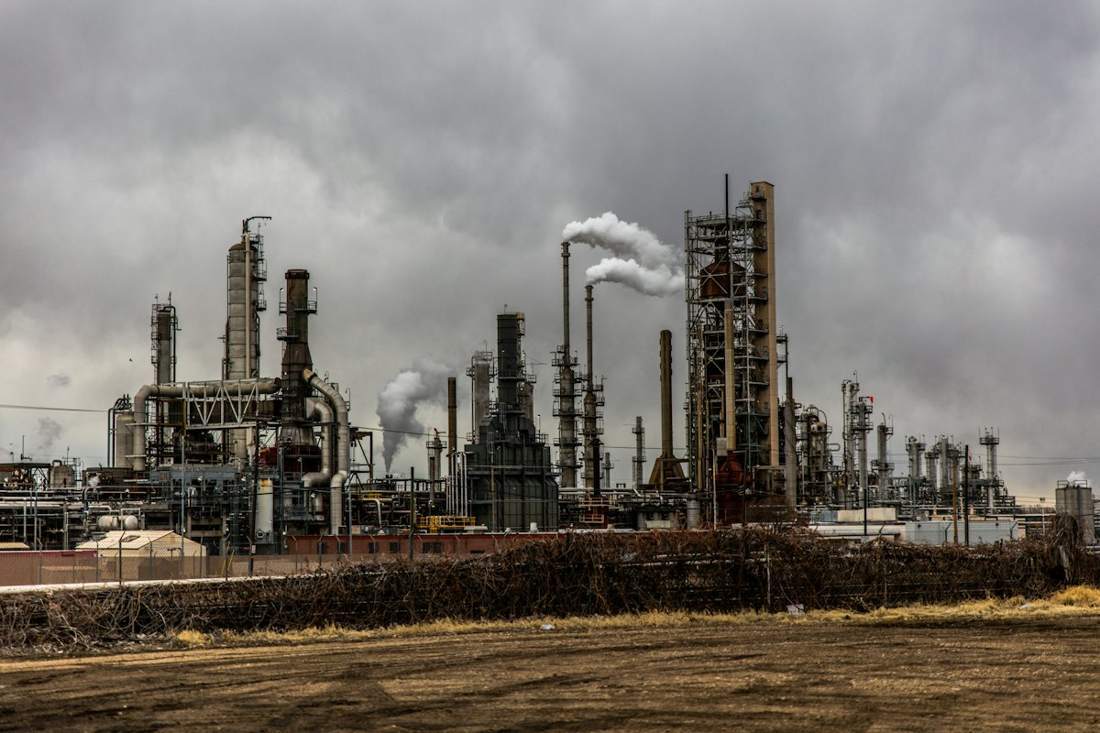 Petrochemical refinery plant with steel piping and towers