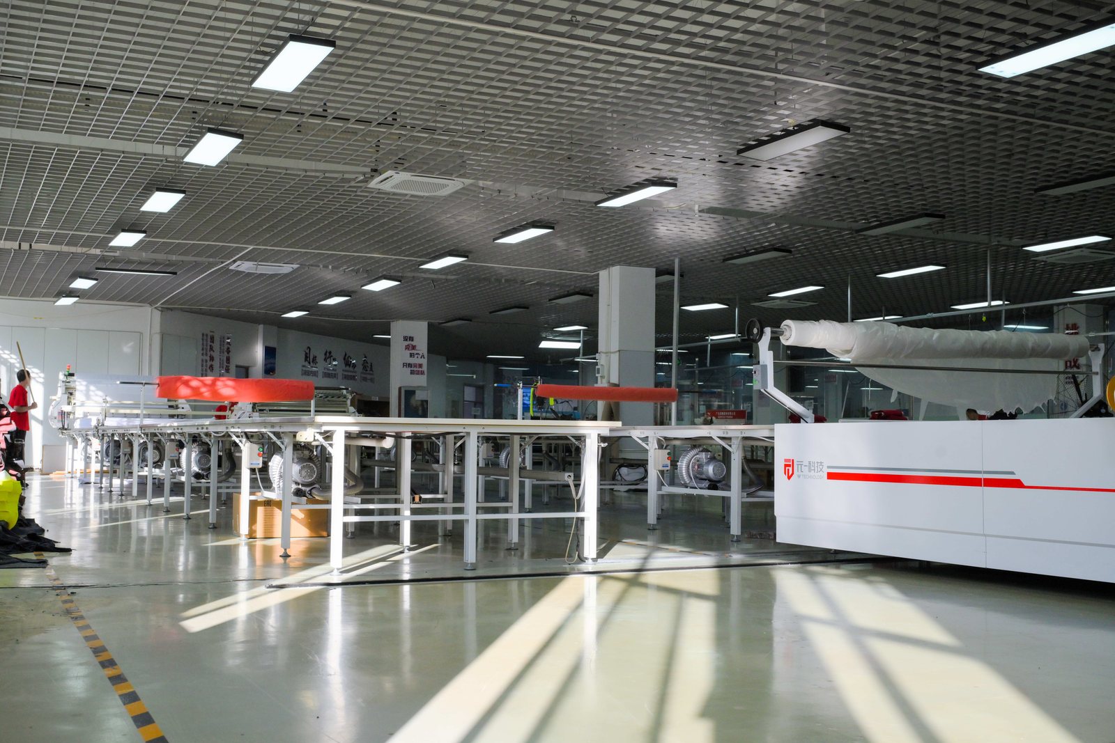 Automated cutting machine with a digital control panel in the workshop