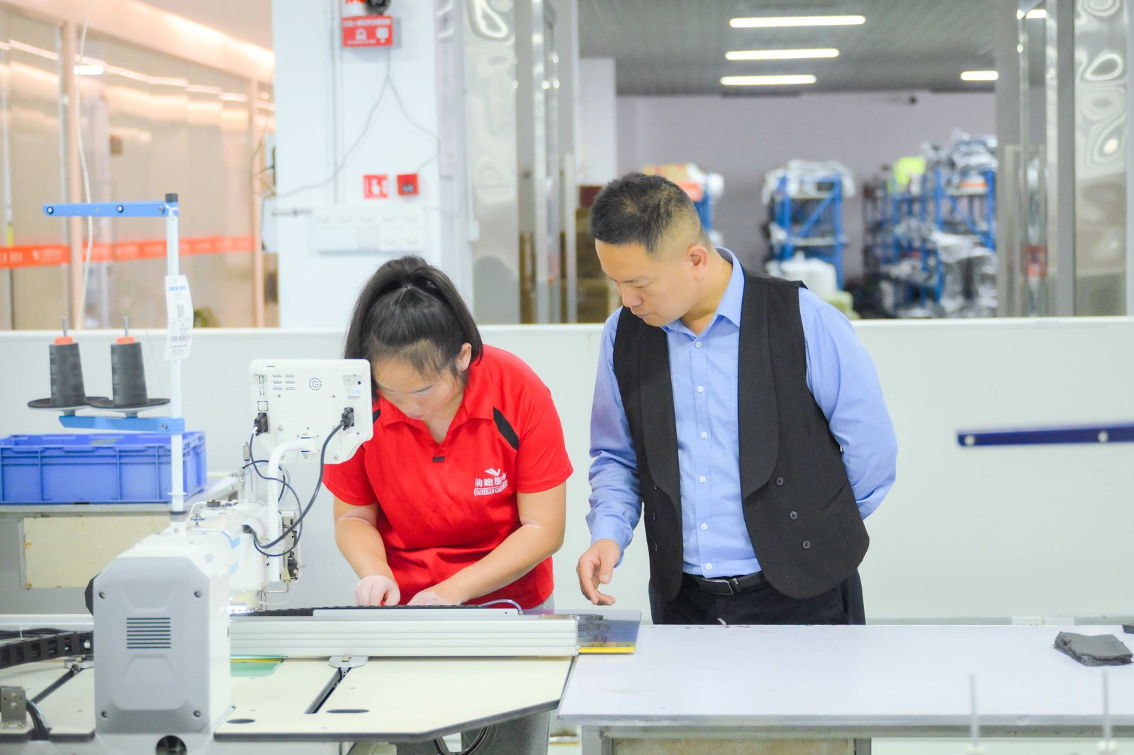 Quality inspector checking a garment on the sewing line