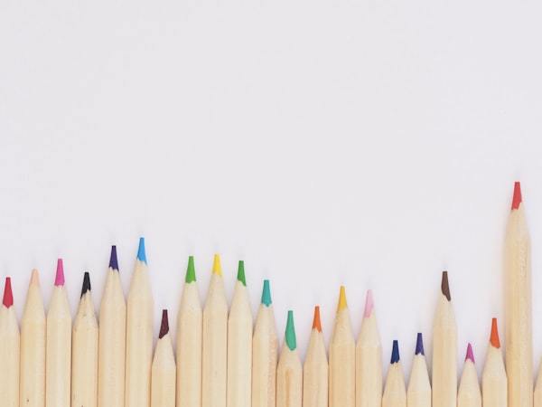 Toddler drawing with colorful art supplies