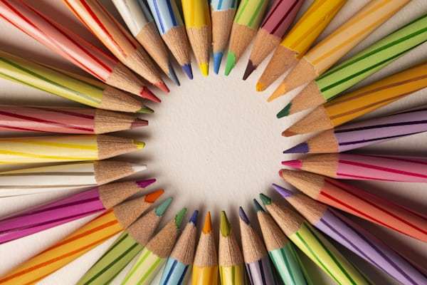 Professional artist testing colored pencils quality for distribution