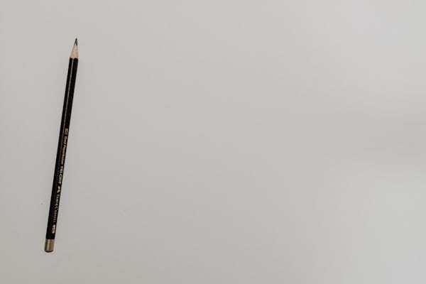 Close-up of graphite pencil on white surface