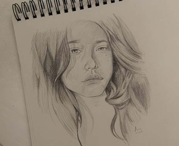 Finished pencil sketch portrait on white paper