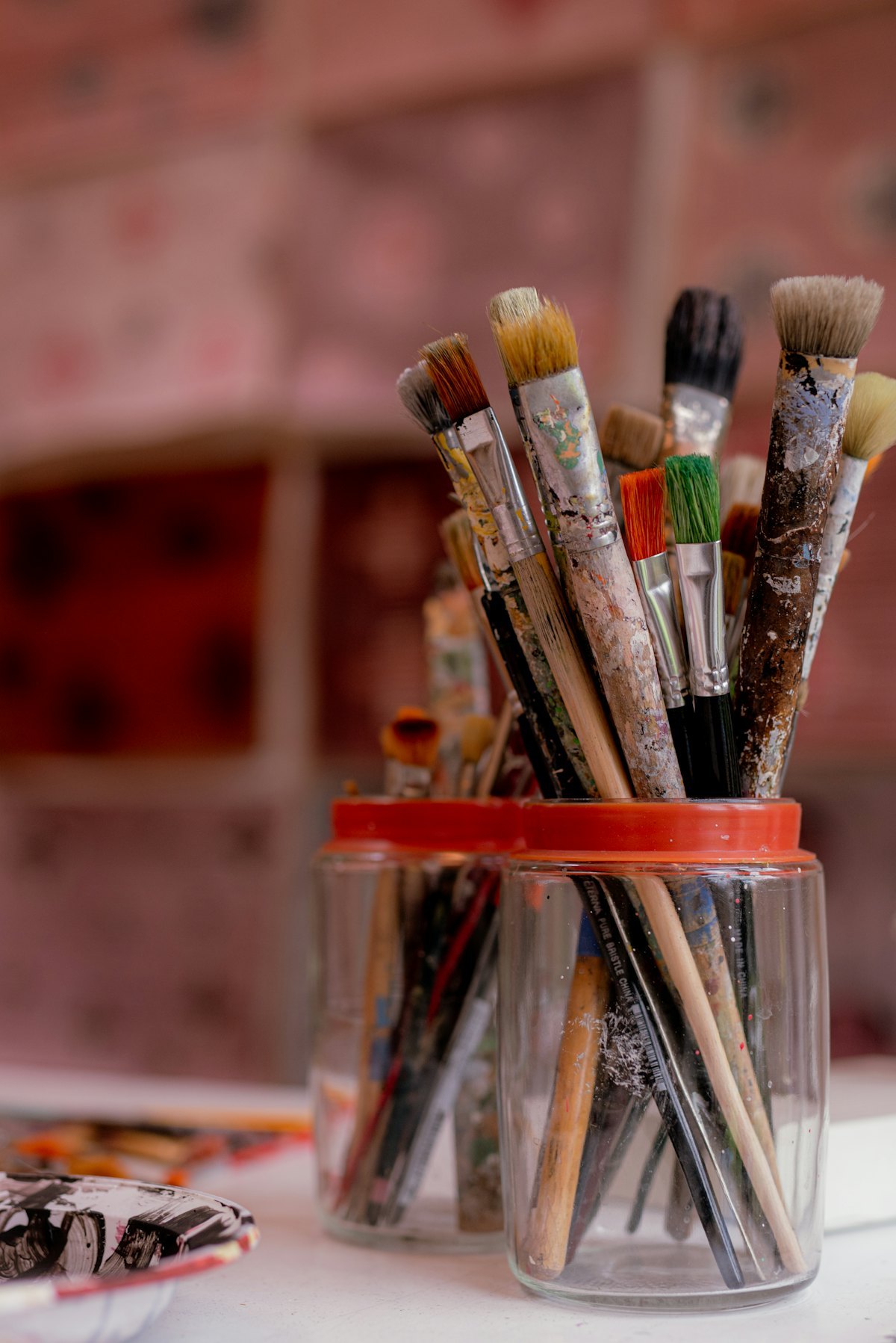 Art supplies sets arranged with their retail packaging boxes and cases