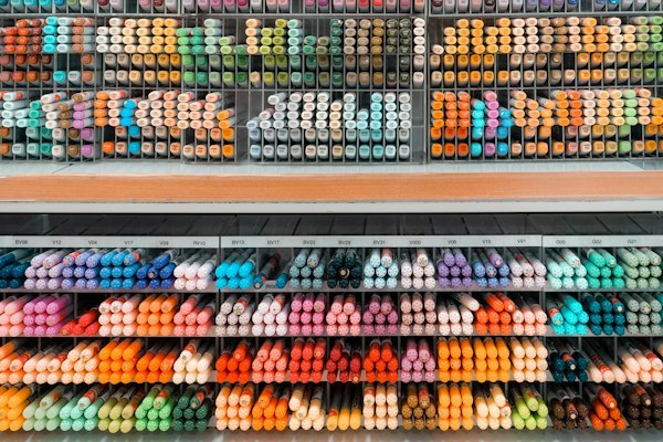 Color-coded marker pens arranged on a retail shelf