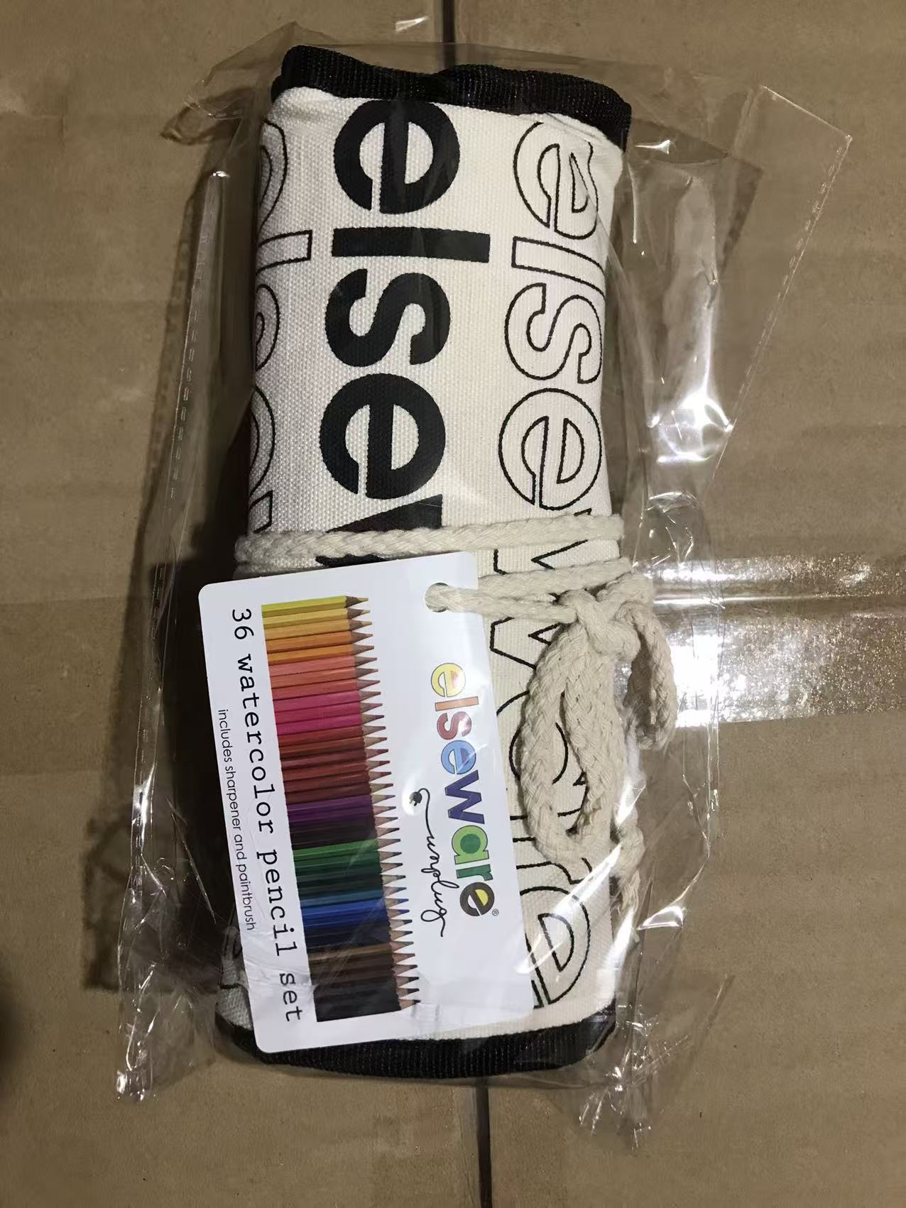 Rolled Elseware canvas wrap with watercolor pencil set label