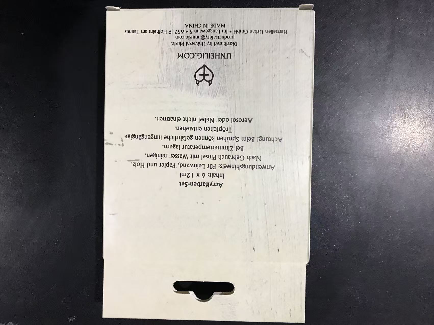 Reverse panel of the Unheilig hanging carton showing product copy