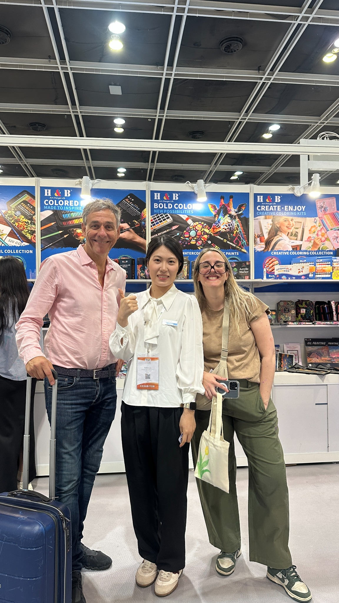 H&B Art representative posing with visitors at the MEGA SHOW 2026 booth