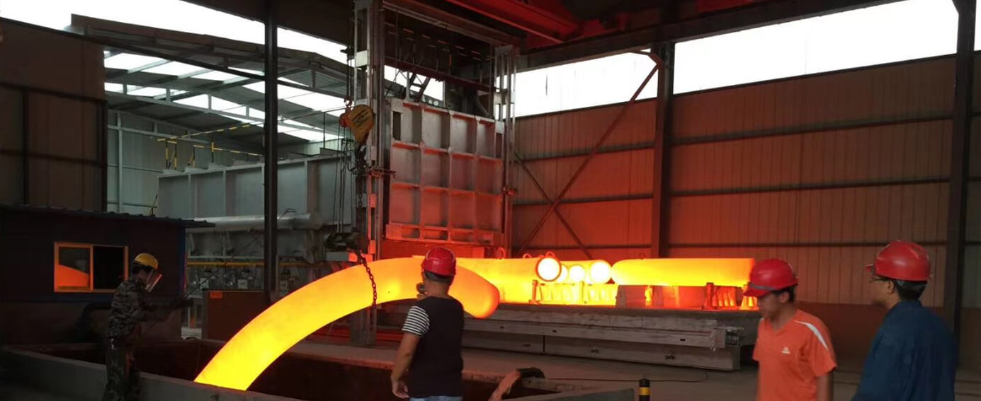 hot treatment of carbon steel pipe bends