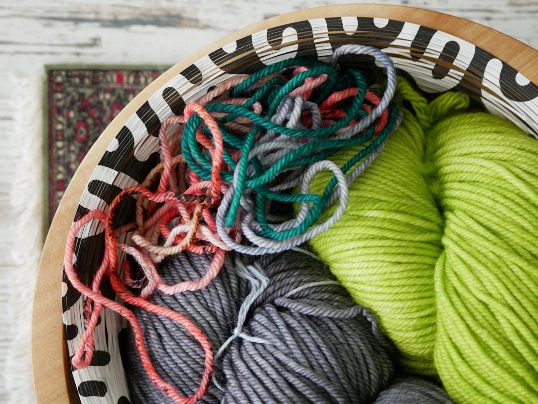 Green, red and blue yarn cones