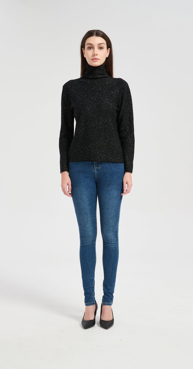 Black lurex cashmere turtleneck sweater showing the sparkle of the metallic yarn and the slim fit through the body