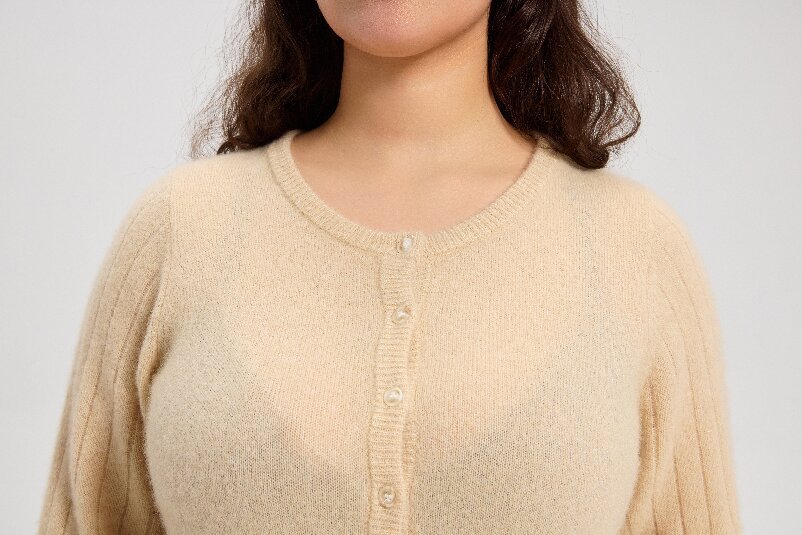 Close-up of cardigan neckline and button placket
