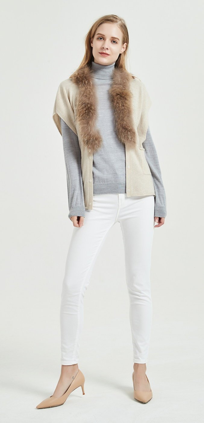 Cashmere poncho-style layer worn over a fine-gauge knit