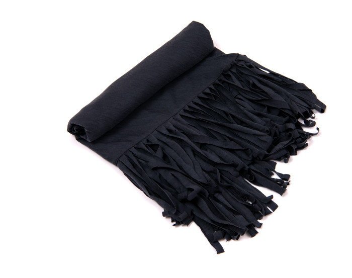 Fringed cashmere wrap laid flat showing twist direction and strand density