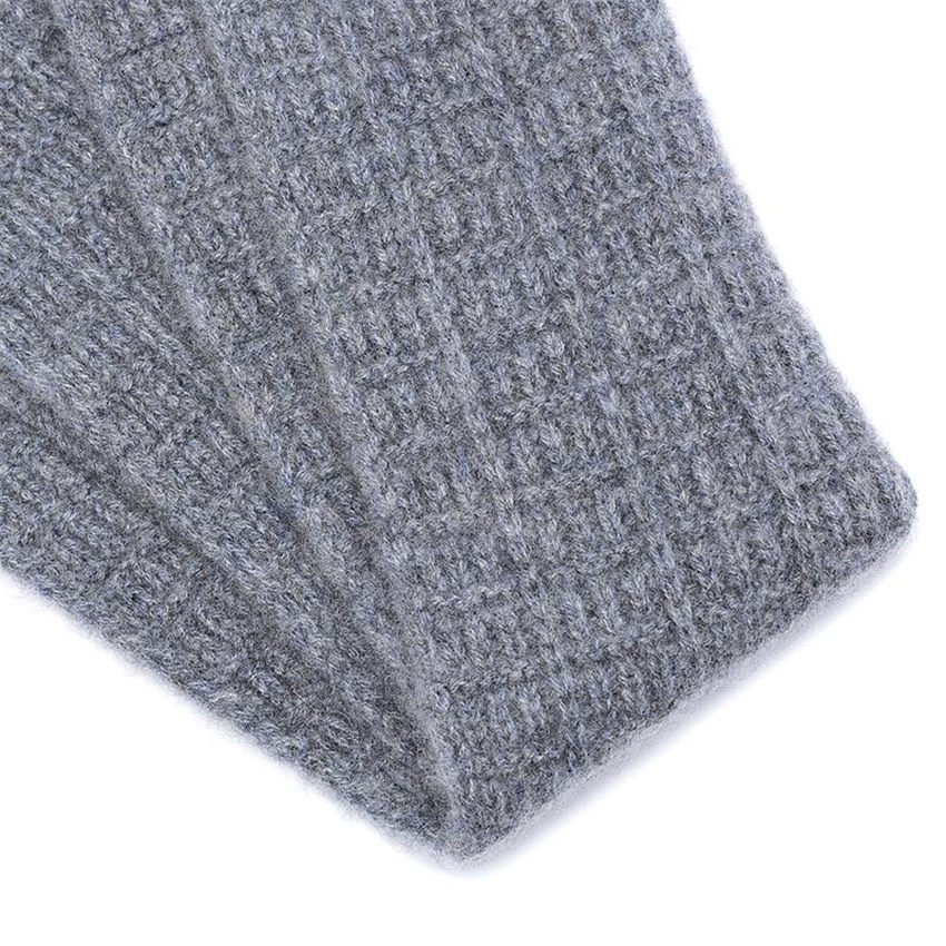 Close macro view of a brushed grey cashmere knit surface