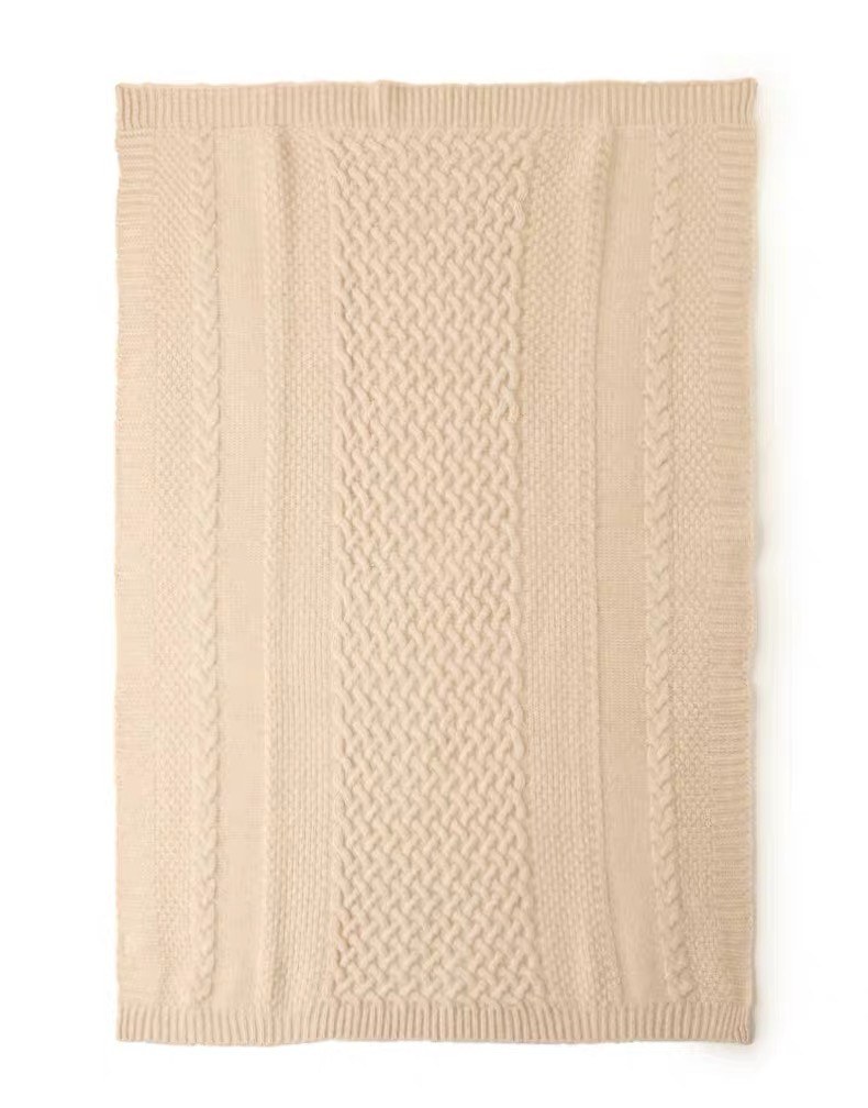 Oatmeal cashmere throw laid flat showing a framed border and an all-over waffle grid texture