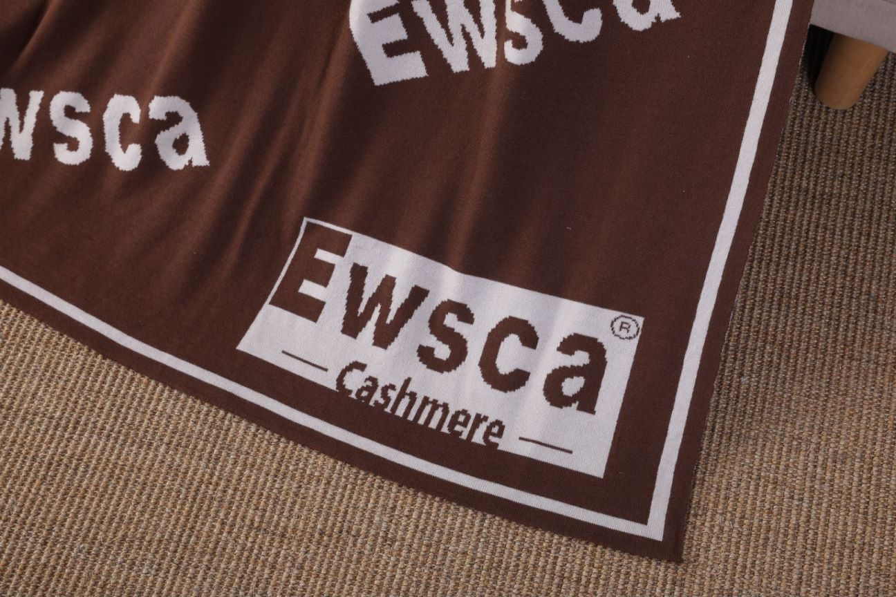 Woven brand and composition label on cashmere knitwear, close up
