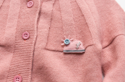 suéter de cachemira con costillas especiales para niña de color rosa con cuello redondo