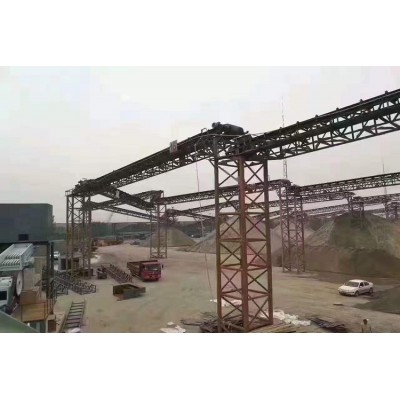 High performance stacking belt conveyor system for crushed rock and aggregate storage