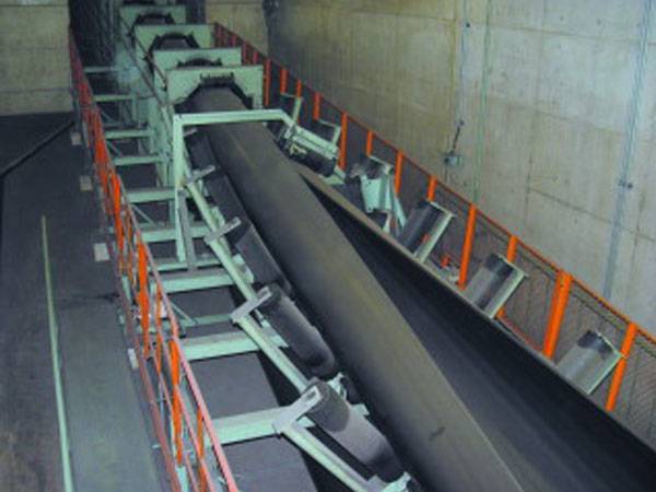 Pipe belt outlet conveyor