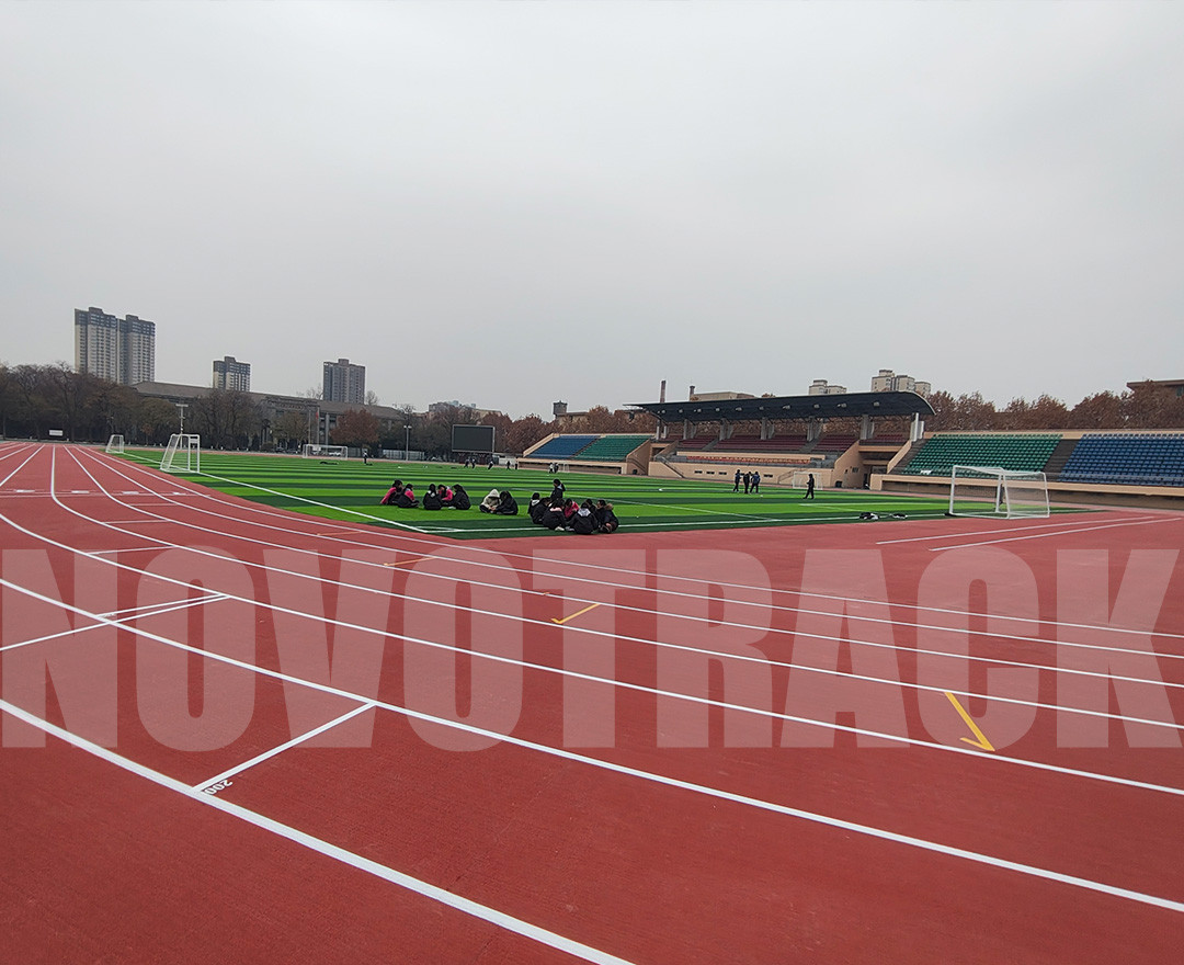 Synthetic running track surfaces