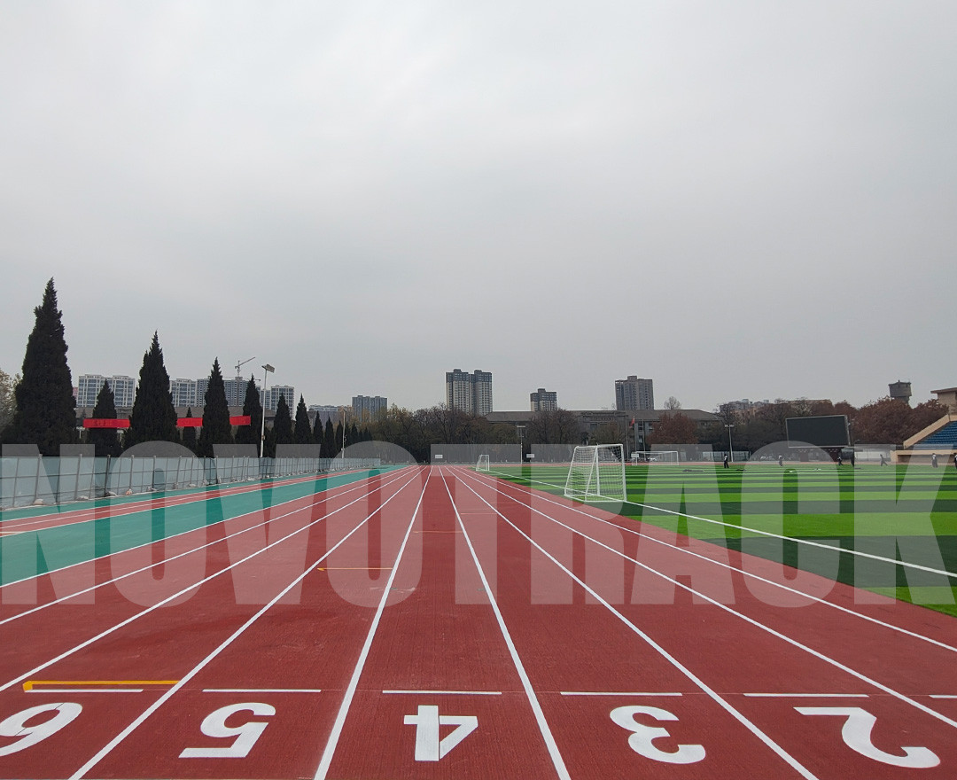 Synthetic running track surfaces