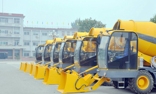 What are the advantages of an automatic loading mixer better over a fixed station mixing plant?