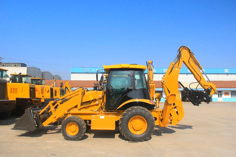 What is the cause of the failure of the boom at backhoe loader