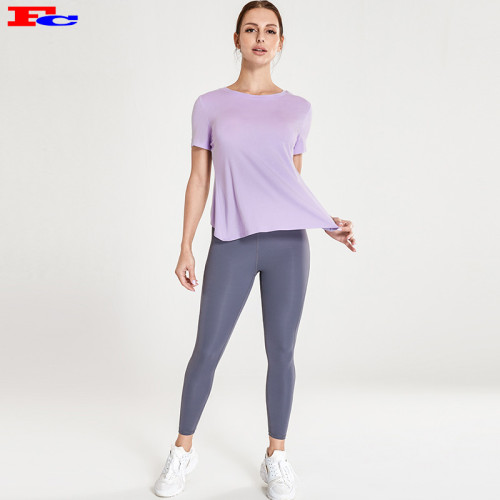 Produttori di abbigliamento da allenamento per maglietta viola chiaro con incrocio sul retro e leggings grigio scuro