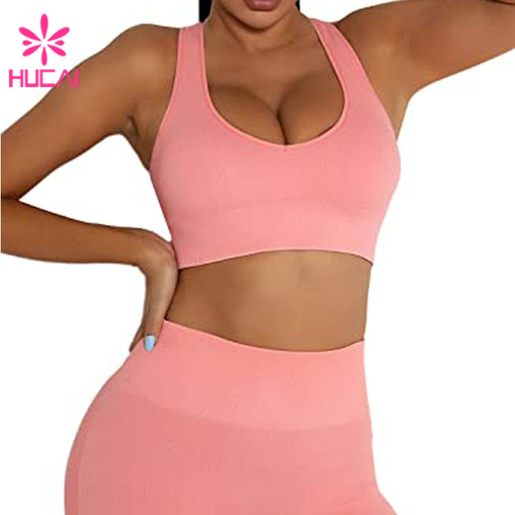 Front view of a matching pink ribbed sports bra and high-rise shorts set in the same tone