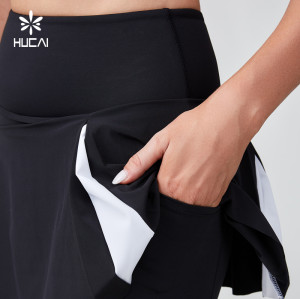 HUCAI Sportswear Manufacturer OEM Tennis Skirt Black And White Patchwork A-line With Inner Shorts