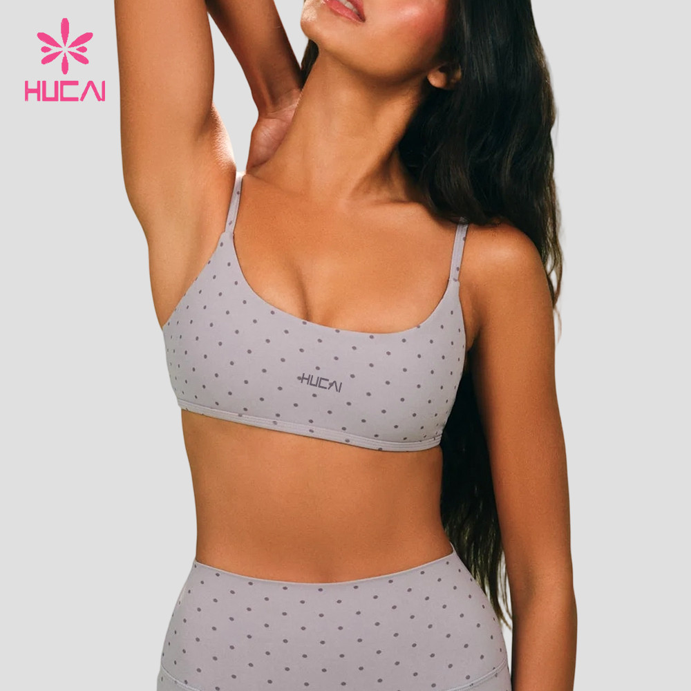 Custom Polka Dot Sports Bra with Adjustable Straps for Studio Labels — Front view in the light grey colourway