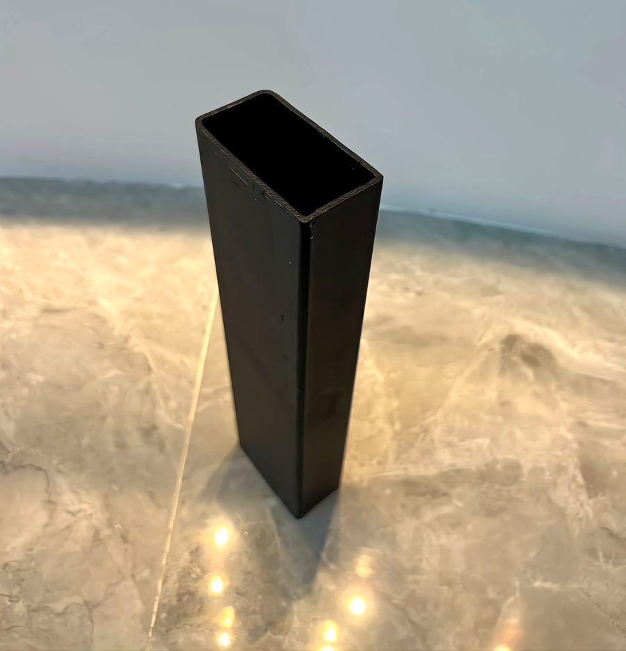 2 x 5 rectangular tube black carbon steel sample showing the 50.8 x 127 mm rectangular hollow cross-section