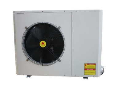 A modern home with an outdoor EVI heat pump unit installed discreetly on the side.