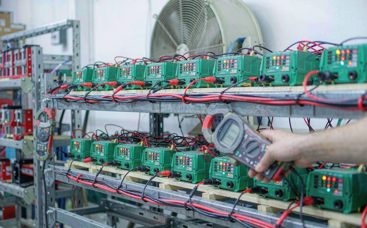 Energizers running a continuous ageing test on factory shelving