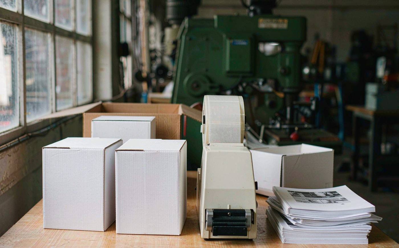 Private-label packaging station with cartons, manuals and labels