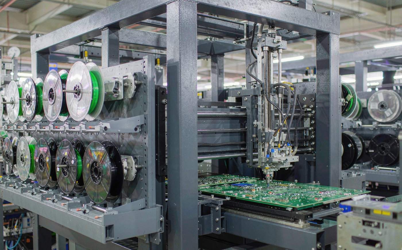 SMT pick-and-place machine placing components on an energizer circuit board