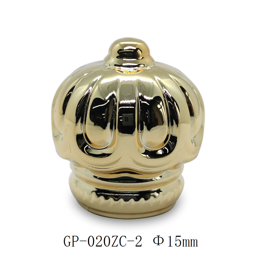 Golden plated zamac perfume cap wholesale | crown shape perfume cap | zinc alloy cap | zamak cap for glass bottle | GP Bottles Manufacturing