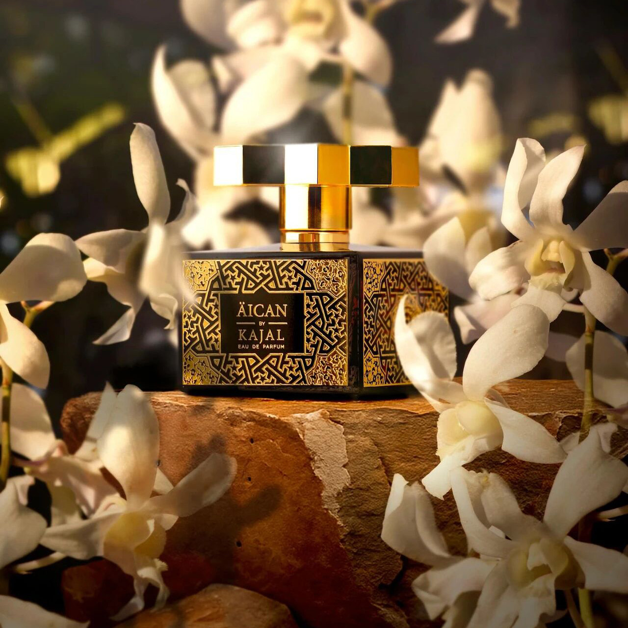 Kajal Perfumes Paris gold glass perfume bottle with luxurious design