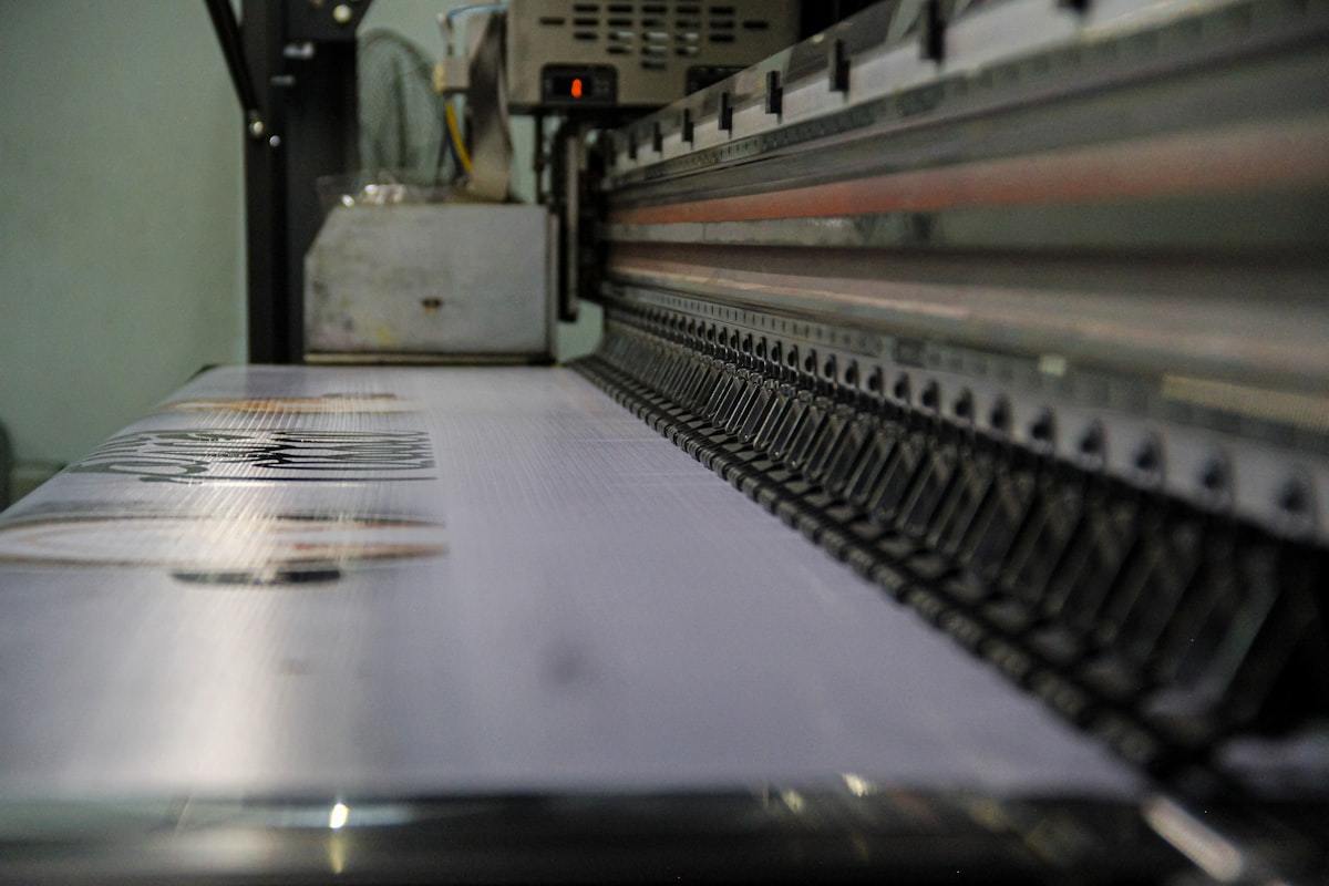 Conveyor line moving perfume box blanks through the production floor