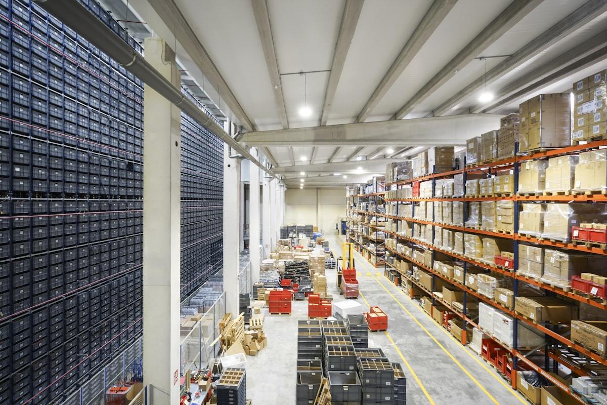 Warehouse holding palletised export cartons of finished perfume packaging