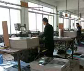 Conveyor line moving perfume box blanks through the production floor
