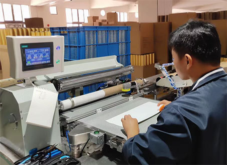 Wide view of the perfume packaging plant showing multiple production machines