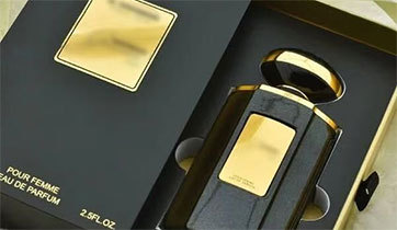 Drawer style perfume box holding a fragrance bottle in a fitted insert