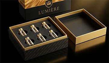 Rigid two-piece perfume gift boxes finished with gold ribbon detail