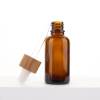 Botellas de aceite esencial con cuentagotas de vidrio ámbar al por mayor | Botellas de tintura con cuentagotas de bambú