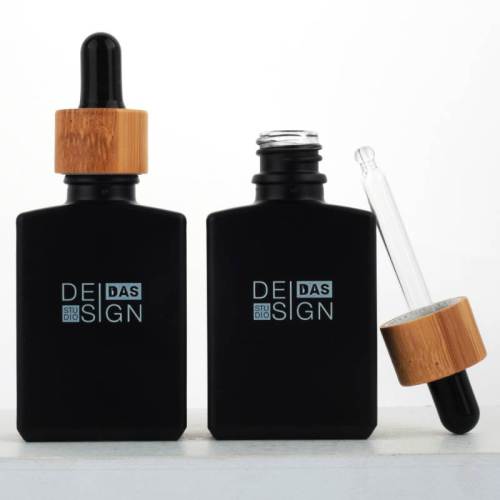 Frasco cuentagotas de vidrio cuadrado de 1 oz Venta al por mayor | Botellas de jugo electrónico de suero negro mate con cuentagotas de bambú