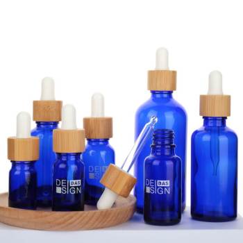 Custom Euro Blue Glass Dropper Bottles for Essential Oils with Bamboo Dropper